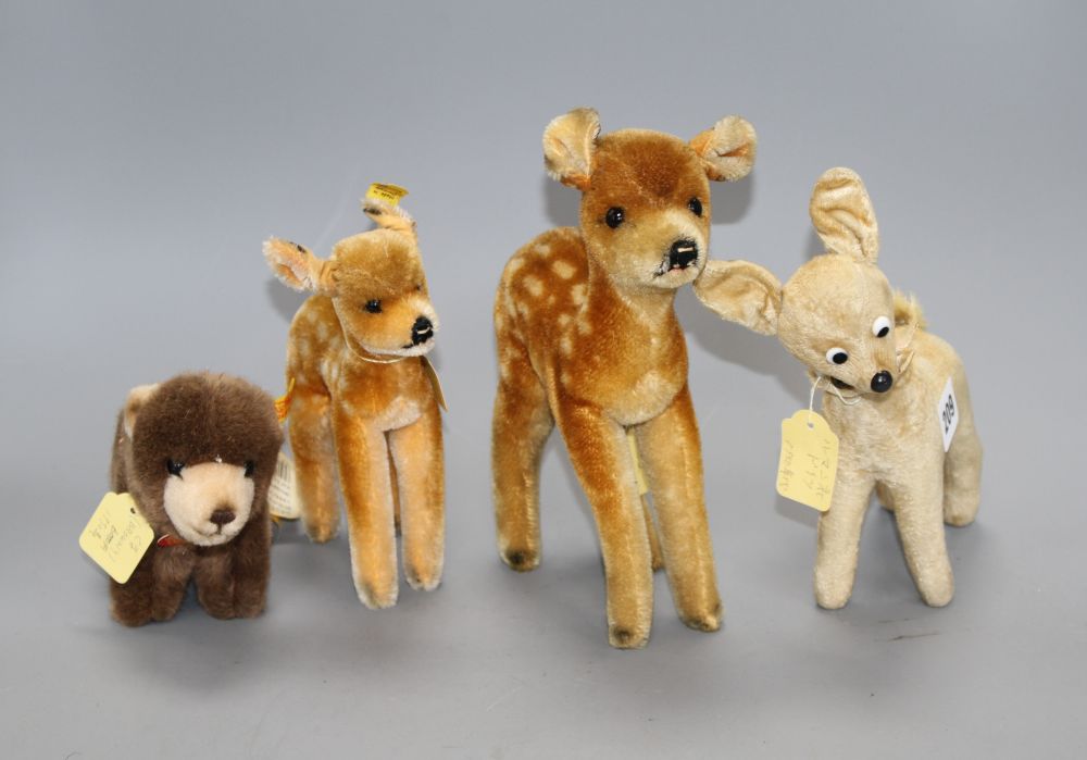 A Steiff Browny bear, a 1950s Steiff deer and two other deer